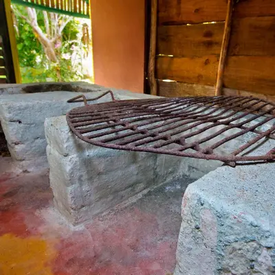 a metal bed sitting on top of a stone slab at Casa Villa Anacahuita in Jarabacoa