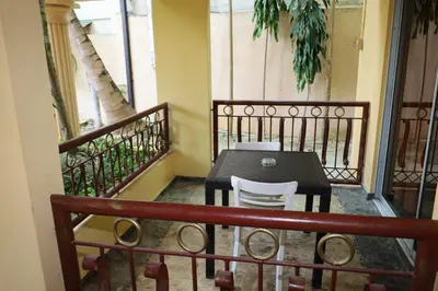 a table and two chairs on a balcony at Aparta-Hotel Villa Baya in Bayahibe