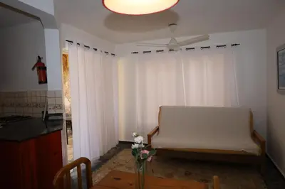 a living room with a couch and a ceiling fan at Aparta-Hotel Villa Baya in Bayahibe