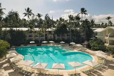 an overhead view of a swimming pool with umbrellas at Impressive Punta Cana - All Inclusive in Punta Cana