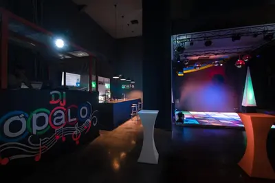 a room with a stage with a soda sign on it at Impressive Punta Cana - All Inclusive in Punta Cana