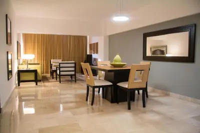 a dining room with a table and chairs at Radisson Hotel Santo Domingo in Santo Domingo