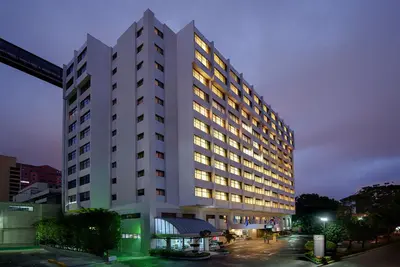a large white building with lights on at Radisson Hotel Santo Domingo in Santo Domingo