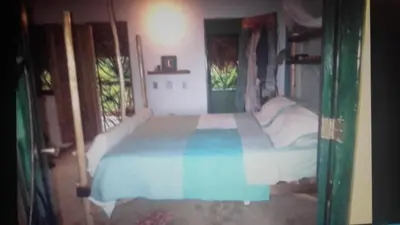 a bedroom with a bed in a room at La Casa Del Arbol in Las Galeras