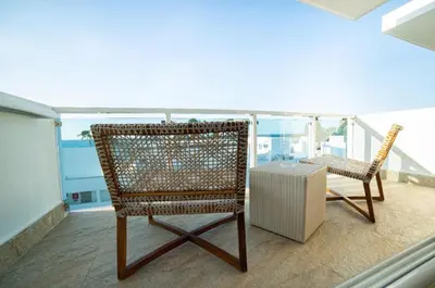 two chairs and a table on a balcony at Presidential Suites Cabarete - Room Only in Cabarete