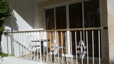 a balcony with a table and chairs on it at Pez 106 in Bayahibe