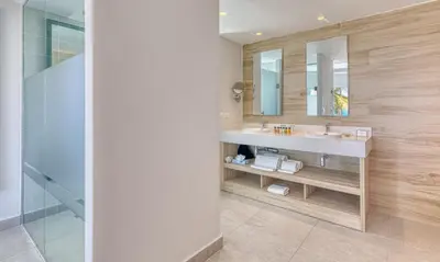 a bathroom with a sink and a mirror at Senator Puerto Plata in San Felipe de Puerto Plata