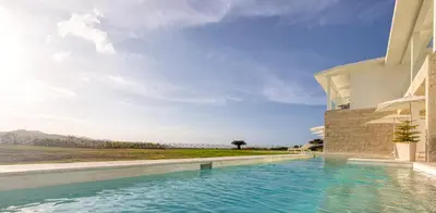 a swimming pool in front of a building at Senator Puerto Plata in San Felipe de Puerto Plata