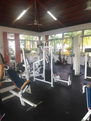 a gym with several treadmills and machines at PARADISE 3 Cerro Altos in Santiago de los Caballeros