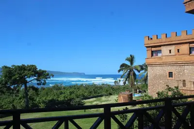 a view of the ocean and a castle at El Castillo in Las Galeras