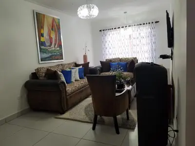 a living room with a couch and a table at Ave. Duarte k3/12, Residencial Palma Real, Santiago, RD in Arenoso