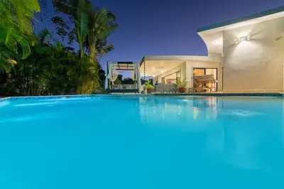 a large swimming pool in front of a house at 883 Residencial Casa Linda in Sosúa
