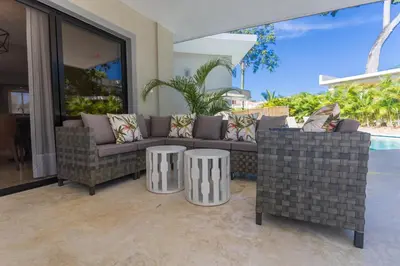 a living room with a couch and two tables at 883 Residencial Casa Linda in Sosúa