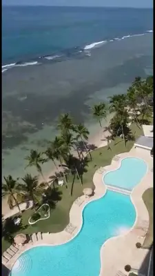an aerial view of the pool at the resort at Beachfront, Juandolio in Juan Dolio