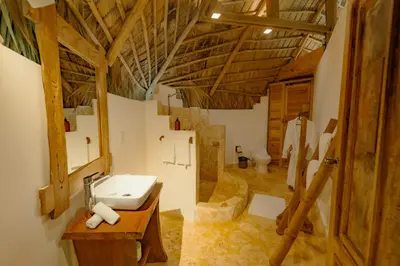 a bathroom with a sink and a toilet at El Valle Lodge in El Valle