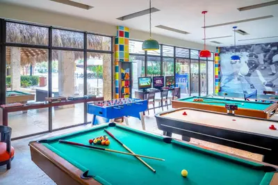 a billiard room with two pool tables at Dreams La Romana All-Inclusive Resort & Spa in Bayahibe