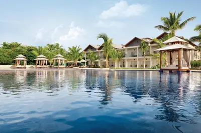 a swimming pool in front of a resort at Secrets La Romana All-Inclusive Adult Only Resort & Spa in Bayahibe