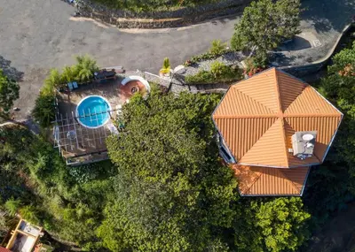 an overhead view of a house with a pool at Mansion Dubai-Mountain-Jacuzzi-4BR-Jamaca De Dios in Jarabacoa