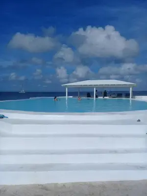 a beach with a pavilion in the middle of the water at Million View Room Adults Only Resort 3 in La Laguna