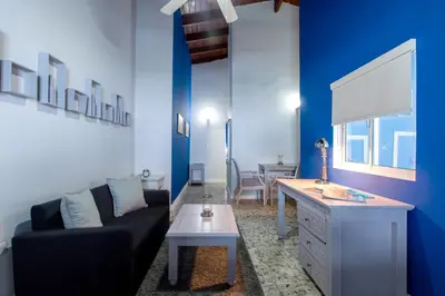 a living room with a couch and a table at Hotel Checkin El Cortecito Beach in Punta Cana