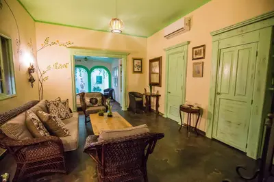 a living room with a couch and a table at Hotel San Marco in Santo Domingo