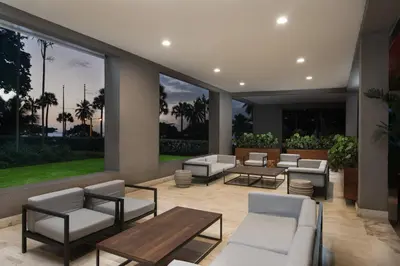 a patio with couches and a table and chairs at Sheraton Santo Domingo in Santo Domingo