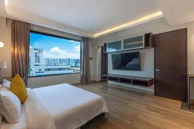 a hotel room with a bed and a large window at Weston Suites Hotel in Santo Domingo