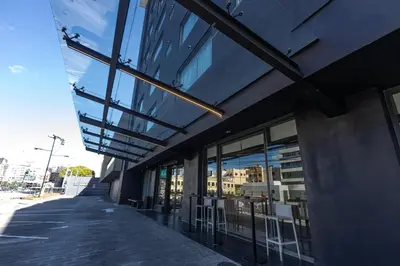 a building with glass windows on the side of it at Weston Suites Hotel in Santo Domingo