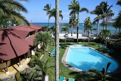 an aerial view of a resort with a swimming pool and the ocean at La Dolce Vita 12 Beachfront Hotels, Las Terrenas, Samana in Las Terrenas