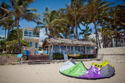 a kite laying on the sand on a beach at Kite Beach Inn in Cabarete