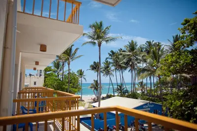 a view of the beach from the balcony of a resort at Kite Beach Inn in Cabarete