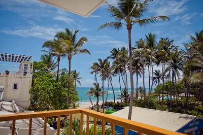 a view of the beach from the balcony of a resort at Kite Beach Inn in Cabarete