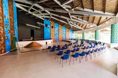 a large hall with chairs and a stage in it at Tropical Deluxe Princess - All Inclusive in Punta Cana