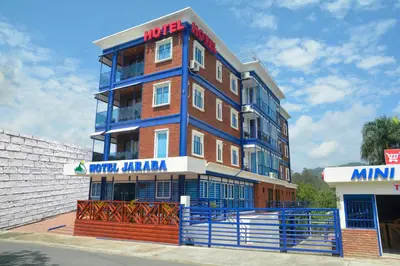 a multi story building on the side of a street at Hotel Jaraba in Jarabacoa