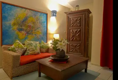 a living room with a couch and a table at Hotel Coco Plaza in Las Terrenas