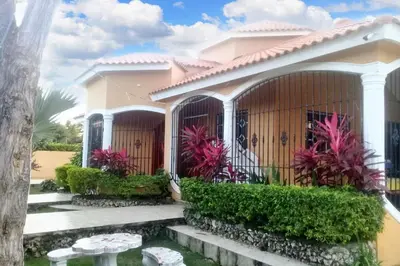 a villa with a garden in a resort at Elegant Villa in Nagua with Private Pool and Jacuzzi in Nagua