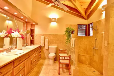 a bathroom with a toilet and a sink and a shower at CASA NOSTRA RESORT by Klabhouse in La Romana