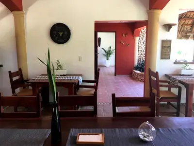 a dining room with a table and chairs at Cabrera Chalet boutique hotel in Cabrera
