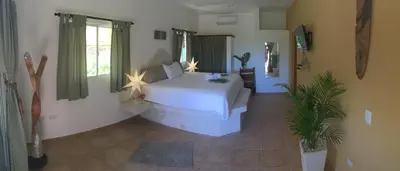 a bedroom with a white bed in a room at Cabrera Chalet boutique hotel in Cabrera