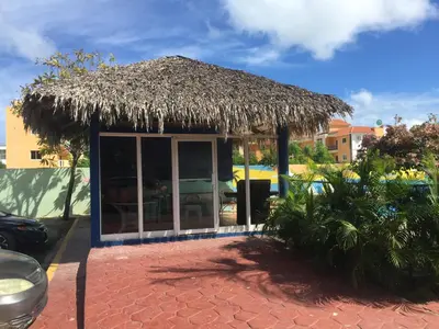 a small hut with a thatched roof at Lugo`s guest room in Punta Cana