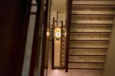 an overhead view of a stairway with a clock at Plaza Florida Suites in Santo Domingo