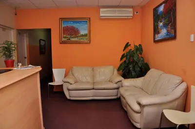 a living room with two chairs and a couch at Hotel Colonial Blanco in Santo Domingo
