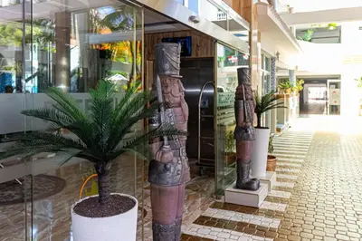 a store front with a statue of a man on the wall at Hotel La Casona Dorada in Santo Domingo