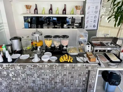 a kitchen with a counter with food on it at City Caribbean Hotel Boutique in Santo Domingo