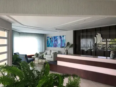 a living room with a couch and a table at Estancia Riviera Colonial I in Santo Domingo