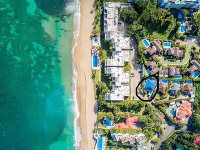 an aerial view of a beach with houses and the ocean at Casa Coral Sosua in Sosúa