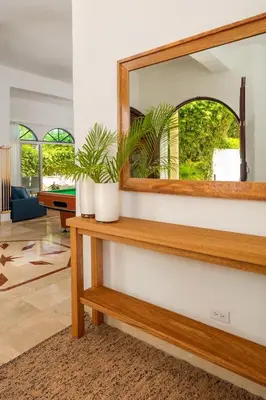 a mirror on a table in a living room at Casa Coral Sosua in Sosúa