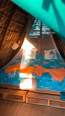 a bed in the middle of a boat at GuaiGüí Bayahibe in Bayahibe