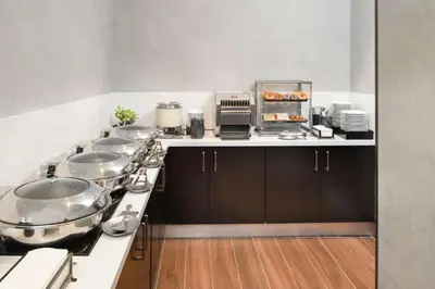 a kitchen with many pots and pans on a counter at Homewood Suites By Hilton Santo Domingo in Santo Domingo