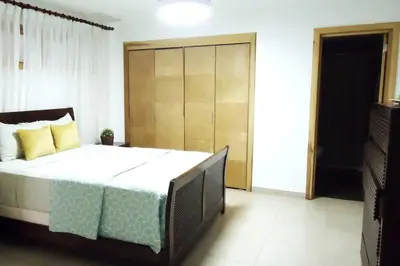 a bedroom with a large bed in a room at Beach Apartment - Marbella, Juan Dolio!! Getaway Offer!! in Juan Dolio